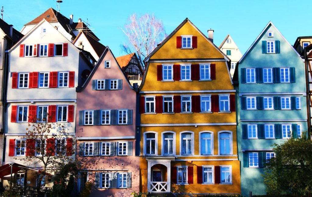 White, Pink, Yellow, and Teal Painted Houses